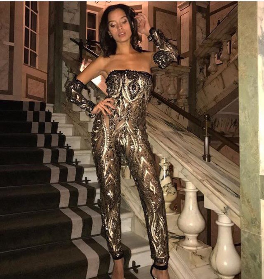 Sequinned jumpsuit on a marble staircase