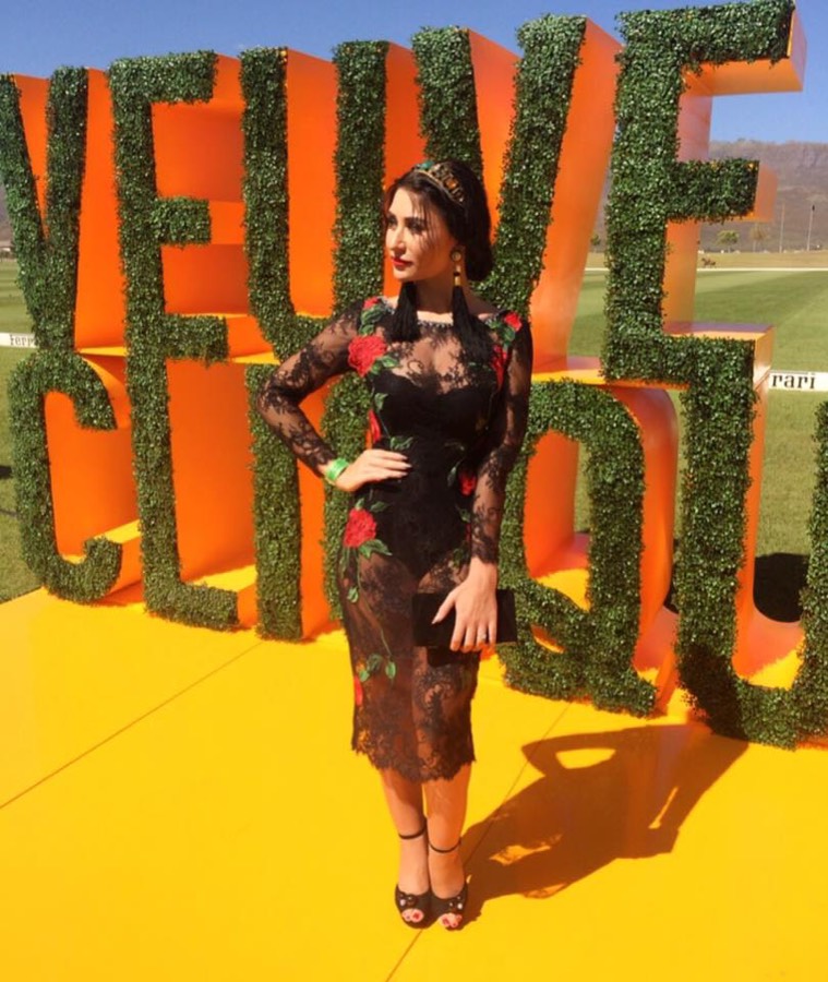 Black lace cocktail dress at an outdoor event