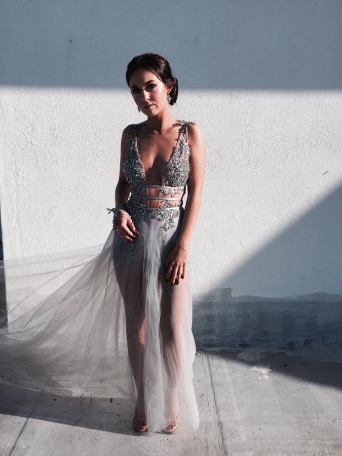 Sheer grey gown with beadwork, shot in hard afternoon light
