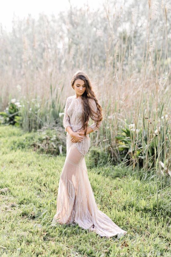 Blush beaded gown photographed in long grass